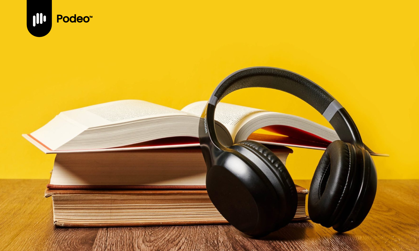 headphones on a book, on a yellow background